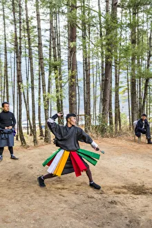 Bhutan Prints: Man playing darts in Paro District, Bhutan
