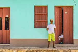 Images Dated 29th May 2020: A man standing outside his house in a street in Trinidad, Sancti Spiritus, Cuba