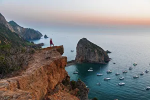 Tyrrhenian Prints: Man stands on top of the cliff above the bay of Palmarola
