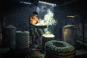 Cook Prints: Man steaming traditional rice cakes in an old kitchen