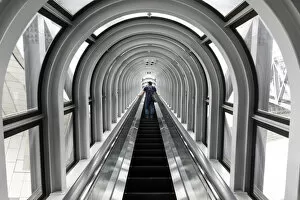 A man takes the escalator up the Umeda Sky building, Osaka, Kansai, Japan