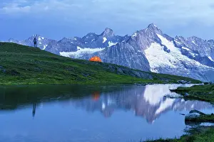 One Person Prints: Man with tent on top of the hill admires the alpine landscape of the Mount Blanc by the lake at dawn