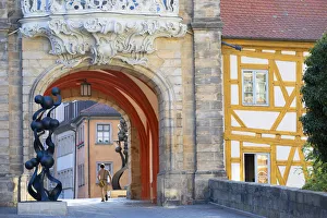 Male Gallery: Man walking under Altes Rathaus (Old Town Hall), Bamberg (UNESCO World Heritage Site)