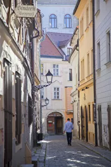 Images Dated 20th November 2013: Man walking along street in Old Town, Bratislava, Slovakia