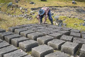 Adobe Gallery: Man at work during manufacture of adobes, the clay brick