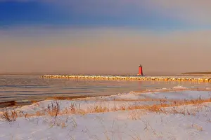 Frigid Prints: Manistique lighthouse along Lake Michigan shoreline at dawn, Manistique, Michigan, USA