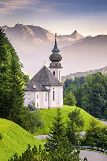 Maria Gern Church, with Bayern Alps and Mount Watzmann on the background, during sunset