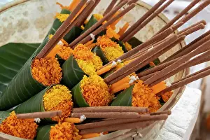Marigolds Prints: Marigold offering at a temple in Luang Prabang (ancient capital of Laos on the Mekong river)