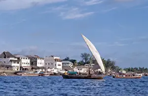 Kenya Coast Prints: A mashua sails out of the sheltered, natural harbour of Lamu Island