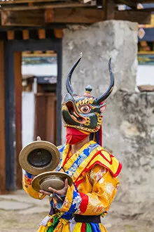 Images Dated 27th May 2020: Masked dancer at a local festival in Paro District, Bhutan