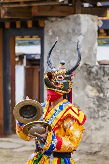 Masked dancer at a local festival in Paro District, Bhutan