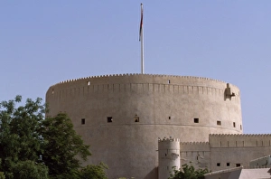 Crenellated Prints: The massive central tower of Nizwa Fort is over 150
