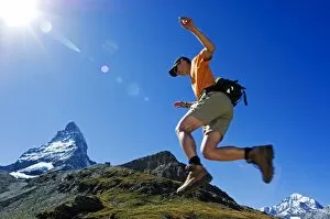 Striking Gallery: A Matterhorn (4477m) hiker running the trail