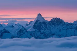 Matterhorn peak over a clouy carpet during a winter sunrise