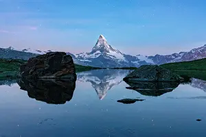 Zermatt Prints: Matterhorn peak reflected in Stellisee idyllic mountain lake at night
