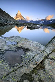 Matterhorn reflected in Lake Stellisee at dawn Zermatt Pennine Alps Canton of Valais