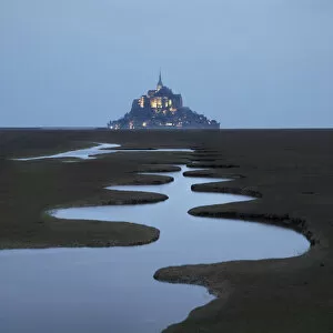 Lit Up Gallery: A meandering pool and Mont Saint Michel at night, Manche, Normandy, France