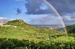 Rain Prints: The medieval castle and Palmela village with a rainbow. Portugal