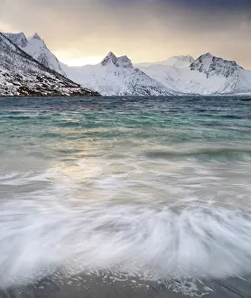 Mefjorden and snow covered mountains in winter, Mefjordbotn, Senja, Norway