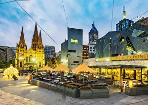 Melbourne, Victoria, Australia. Federation Square and St Pauls Cathedral at dusk