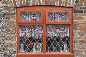 Souvenirs Prints: Memorabilia in the window in Alfriston, East Sussex, England
