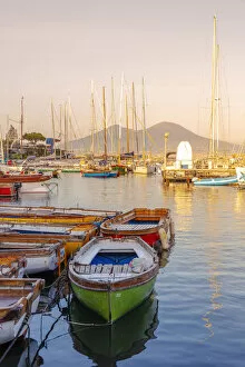 Mergellina, Naples, Campania, Italy. Fishing boat and Vesuvius Volcano on background