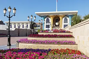 Middle East, Oman, Muscat. Rows of colourful flowers planted in front of Al Alam