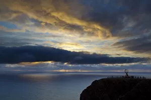 Images Dated 17th November 2010: The Midnight Sun breaks through the clouds at Nordkapp, Finnmark, Norway