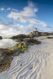 Eggum Prints: Midnight sun lights up lighthouse on cliffs surrounded by sea and sand Eggum Unstad