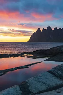 Images Dated 15th October 2021: Midnight sun over the mountain peaks Devils Teeth, Tungeneset, Senja, Troms county