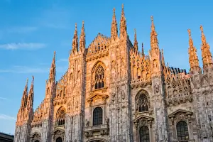 Milan, Lombardy, Italy. Facade of the Milans Cathedral at sunset
