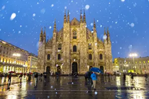 Milans Duomo cathedral in winter with snow and artificial lights. Milan, Lombardy