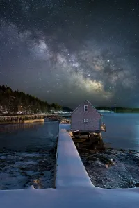 Board Walk Prints: Milky Way over boathouse in Stonington, Deer Isle, Maine, USA