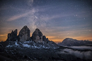 The Milky Way with its stars appear in a summer night on the Three Peaks of Lavaredo The Milky Way with its stars appear in a summer night on the Three Peaks of Lavaredo