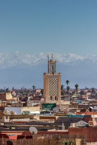 Marrakech Prints: Minaret of the Bab Debbagh mosque and the Atlas Mountains, Marrakech, Morocco