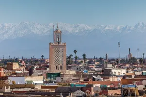 Marrakech Prints: Minaret of the Bab Debbagh mosque and the Atlas Mountains, Marrakech, Morocco