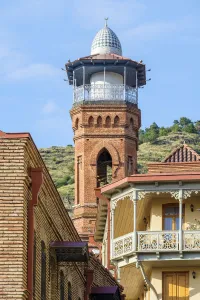 Transcaucasia Prints: Minaret of Jamma Mosque and historic buildings in Abanotubani bath district