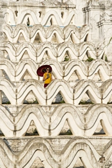 Paya Prints: Mingun, Sagaing region, Myanmar (Burma). Woman with red umbrella in the middle of