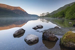 Images Dated 9th June 2020: Mirror reflections at dawn on Llyn Cwellyn in Snowdonia National Park, Wales, UK. Spring