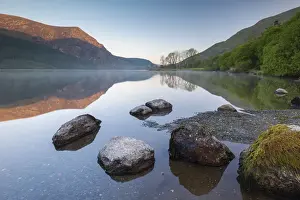 Mirror reflections at dawn on Llyn Cwellyn in Snowdonia National Park, Wales, UK. Spring