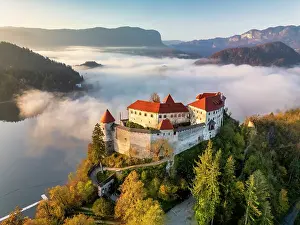 Holiday Destination Prints: Mist over Lake Bled below Bled Castle, Bled, Slovenia, Europe