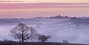 Morchard Bishop Prints: Mist shrouded countryside looking towards the village of Morchard Bishop, Devon, England