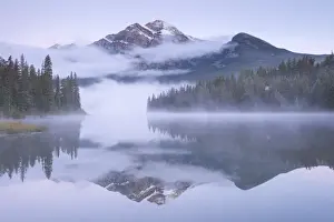 Pyramid Lake Prints: A misty Pyramid Mountain reflected in Pyramid Lake at dawn, Jasper National Park