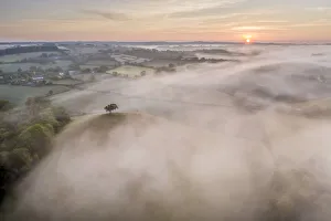 Misty sunrise over the beautiful countryside of Mid Devon, England. Spring (May) 2020