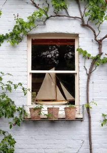 Nautical Prints: Model sailing boat in a cottage window, Teddington, London, England