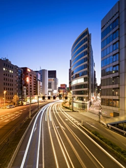 Modern office buildings along a street in Shinjuku, Tokyo, Japan