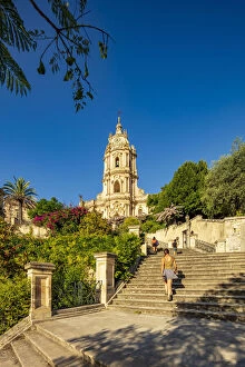 Achitecture Gallery: Modica, Sicily. People walking on the stairs to the baroque Cathedral at sunset