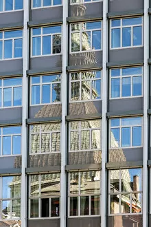 The Mole Antonelliana reflected into a glassy building, Turin, Piedmont, Italy