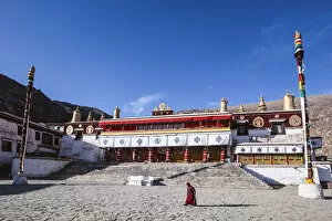Monk in front of Drepung monastery, Lhasa, Tibet, China