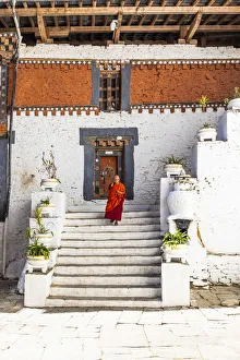 Bhutan Prints: A monk walking in Trongsa Dzong, Trongsa District, Bhutan
